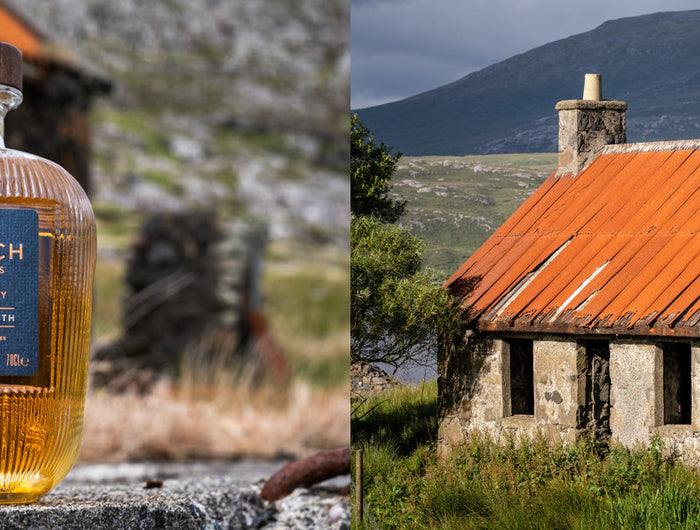 Bottle of Hearach whisky with a scenic background of a stone building and mountains.