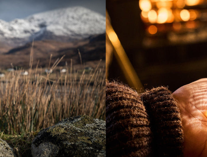Scotch whisky bottle with scenic mountain background and person holding a glass of whisky.