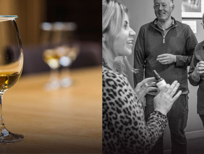Two whisky glasses with whisky on a wooden table, followed by a black and white photo of people at an event.