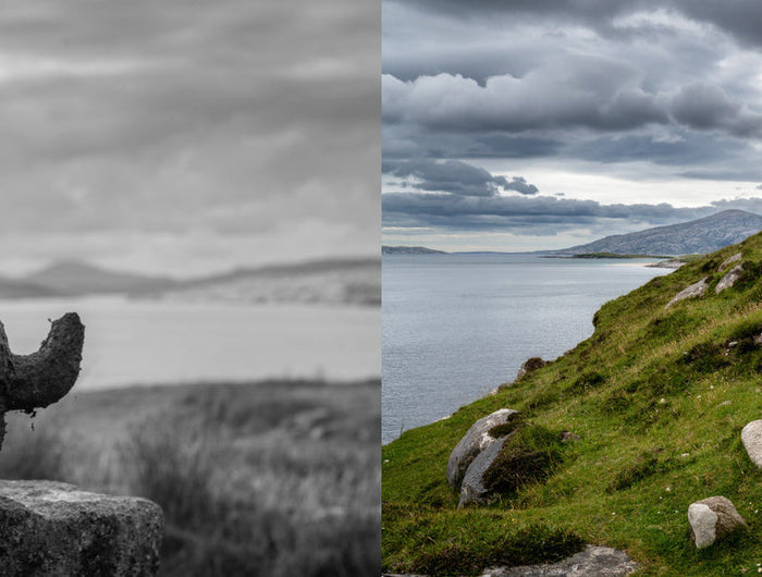 Two contrasting landscapes: a black and white stone sculpture on a cliff edge, and a color image of a scenic path with a wooden cross.